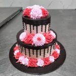 Delicious Fresh Cream Cake – Two-Tiered Cake with Floral Decoration and Chocolate Drip