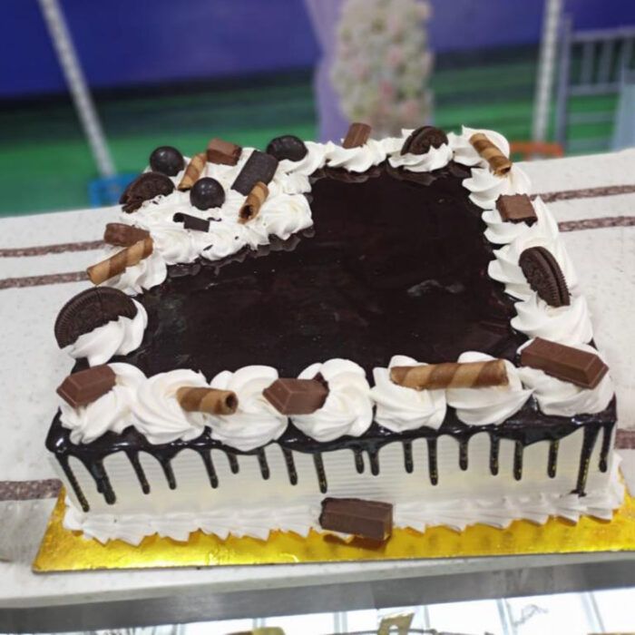 Delicious Fresh Cream Cake – Chocolate Candies and Cookies Cake - Image 1